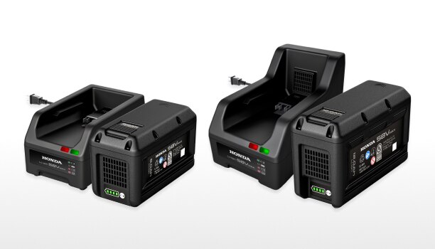 New Standard Charger, 12Ah Battery, Rapid Charger, and 8Ah battery lined up on a white studio background.