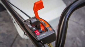 Closeup of the controls on the handlebar of a Honda mower.  