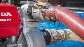Closeup of a Honda pump being used on a residential pool.